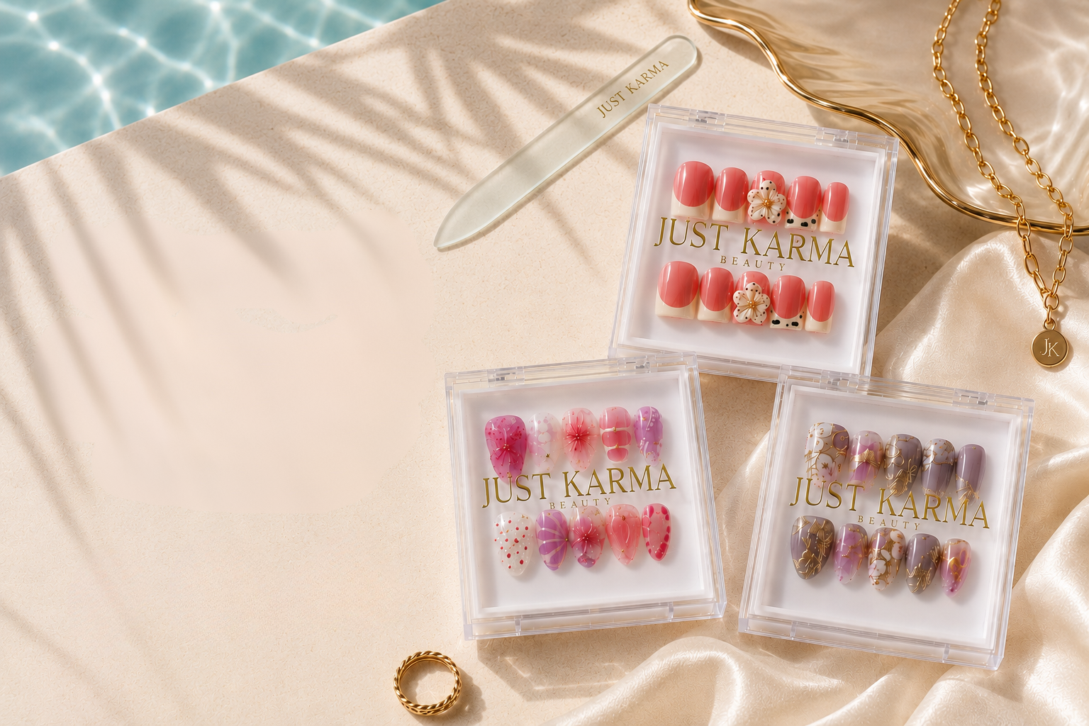 Just Karma Beauty press-on nail boxes in small, medium and large on ivory linen